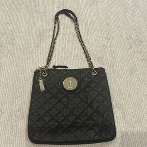 DKNY quilted purse. Gold accents and strap. New condition